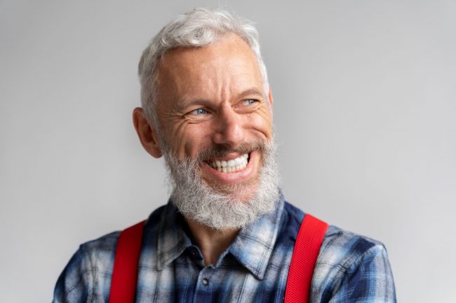 senior-smile-FP Senior male smiling illustrates blog "Does Medicare Advantage Cover Dental Implants? "