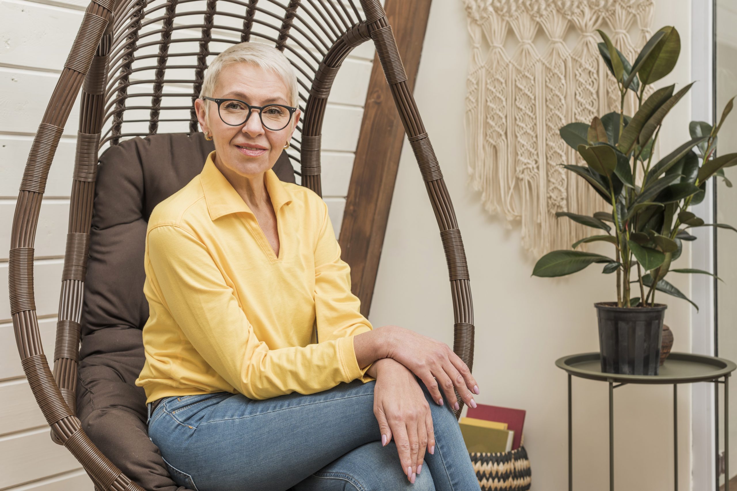 senior-lady-fp Senior woman sitting in living room illustrates blog "Does Medicare Advantage Have a Deductible?"
