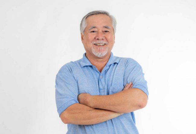 senior-man-suphapotn Senior man with folded arms illustrates blog "What Is the Medicare Advantage Maximum Out-of-Pocket (MOOP) Limit?"