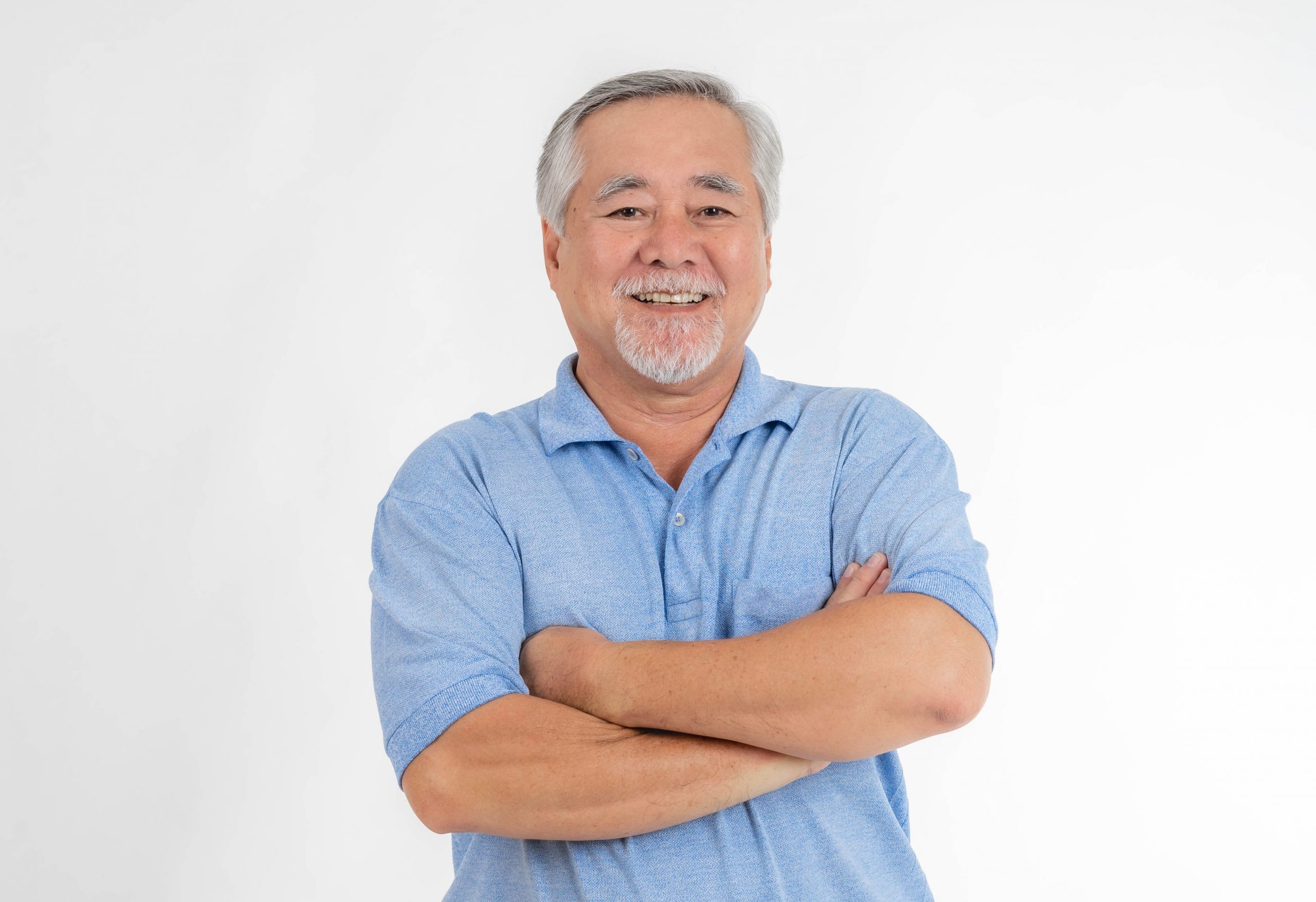 senior-man-suphapotn Senior man with folded arms illustrates blog "What Is the Medicare Advantage Maximum Out-of-Pocket (MOOP) Limit?"