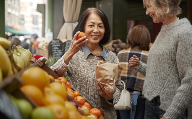 Photo of senior lady in supermarket illustrates blog "Does Medicare Advantage Offer a Grocery Allowance?"