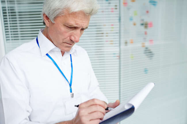 Senior reviewing Medicare plan options in California with insurance agent