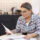 Older adult reading a Medicare Summary Notice and reviewing healthcare expenses