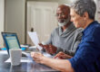 Older adult getting help understanding Medicare late enrollment options