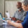 Older adult getting help understanding Medicare late enrollment options
