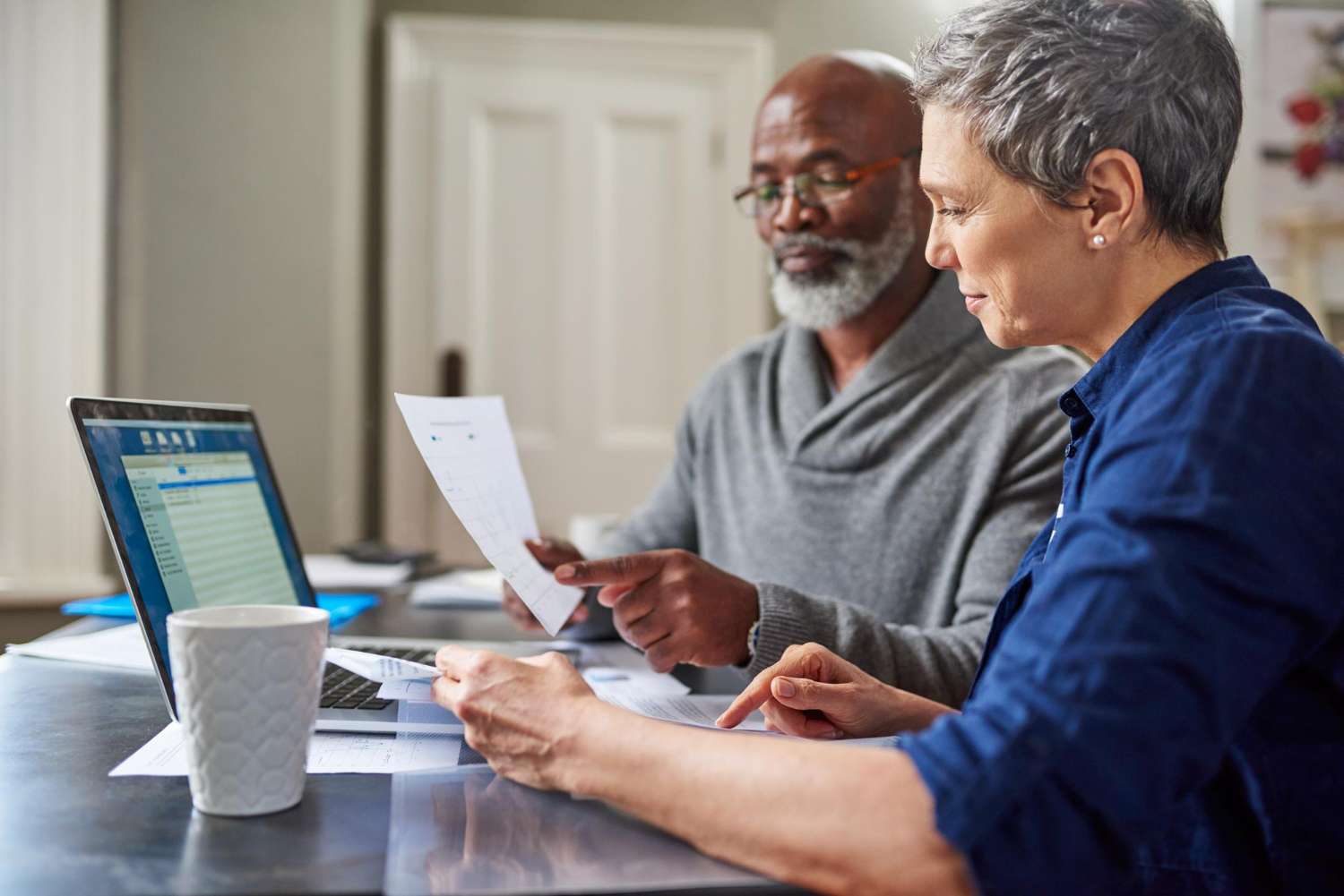 Older adult getting help understanding Medicare late enrollment options